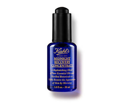 Flacon albastru de ulei esențial Kiehl's Midnight Recovery Concentrate, destinat revitalizării pielii pe timp de noapte.