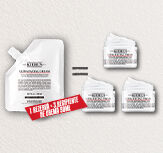 Un banner cu fundal albastru deschis cu textură de gheață, pe care sunt așezate trei mini-produse Kiehl's: Ultra Body Mega Moisture Squalane Cream, Creamy Eye Treatment și Ultra Facial Cream. In spatele produselor se vede efectul de gheață in proces de topire, iar in josul bannerului se vede un ștergător care prinde apa topită. Pe banner este scris "NEW YEAR, NEW ME".