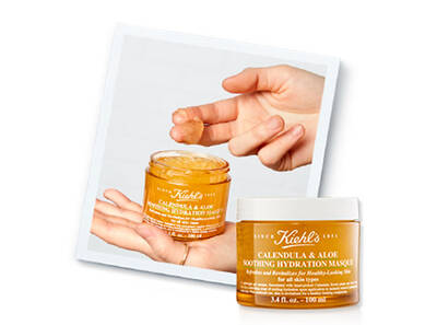 Crema de față Kiehl's cu calendula și aloe, arătată intr-un borcan cu un deget indreptat spre gelul din interior.