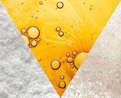 A triangular collage featuring three sections: one with coarse sea salt, another with golden liquid bubbles resembling oil, and the third with fine white sugar crystals.