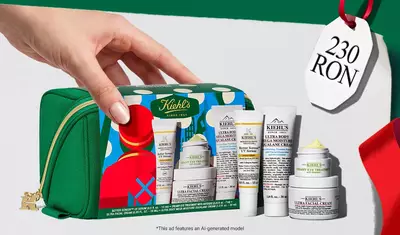 Setul cadou de ingrijire a pielii "Hydrating Holiday Hits" pe un fundal verde, cu cremă facială Ultra și Creamy Eye Treatment with Avocado in ambalaje festive.