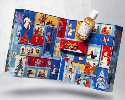 Un calendar advent cu ilustrații colorate și o sticlă plasată deasupra.